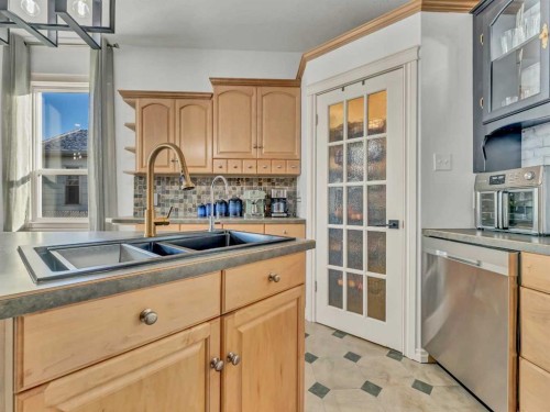 27 4 Street Sw, Medicine Hat, AB - Indoor Photo Showing Kitchen With Double Sink