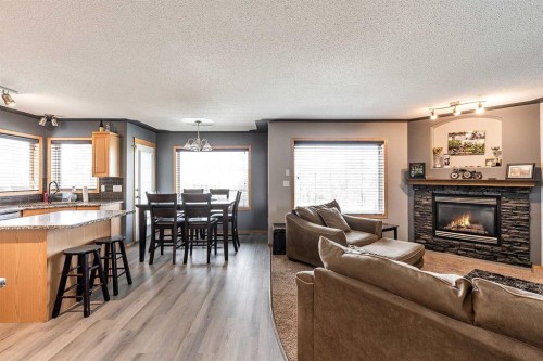 484 Stark Way Se, Medicine Hat, AB - Indoor Photo Showing Living Room With Fireplace