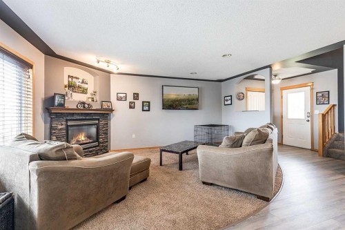 484 Stark Way Se, Medicine Hat, AB - Indoor Photo Showing Living Room With Fireplace