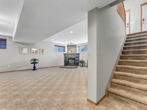 28 Stark Mews Se, Medicine Hat, AB - Indoor Photo Showing Other Room With Fireplace