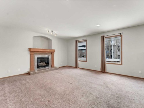 18 Vista Close Se, Medicine Hat, AB - Indoor Photo Showing Living Room With Fireplace