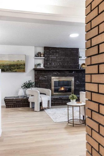 150 11 Street Ne, Medicine Hat, AB - Indoor Photo Showing Other Room With Fireplace
