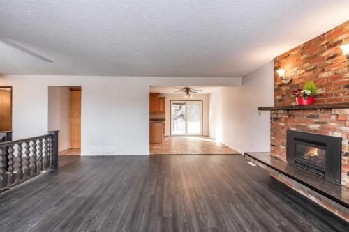 1321 19 Street Se, Medicine Hat, AB - Indoor Photo Showing Living Room With Fireplace