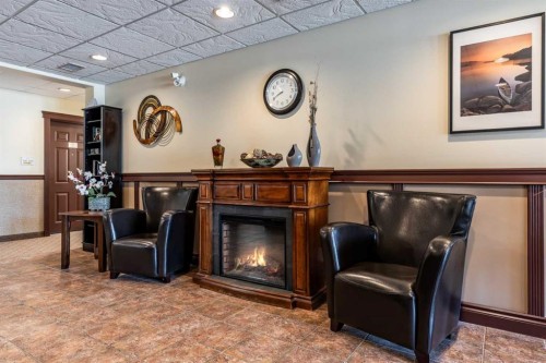 209-105 Main Street South, Redcliff, AB - Indoor With Fireplace