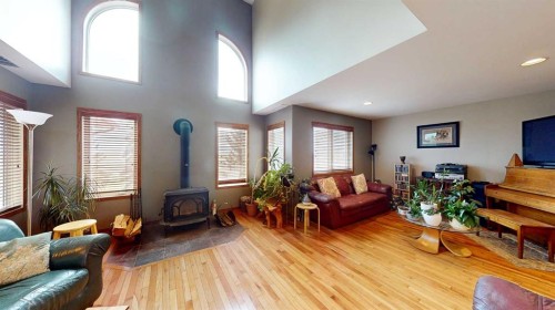 443 East 9 Avenue, Dunmore, AB - Indoor Photo Showing Living Room With Fireplace