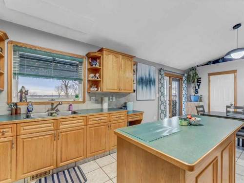 9 Riverview Green Se, Redcliff, AB - Indoor Photo Showing Kitchen With Double Sink