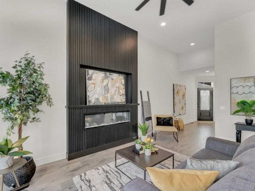 34 Palisades Way Ne, Medicine Hat, AB - Indoor Photo Showing Living Room With Fireplace