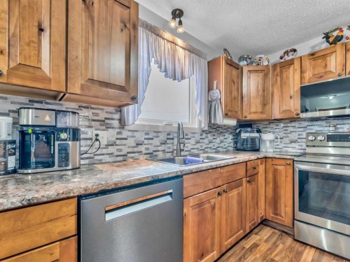 12002 Range Road 65, Rural Cypress County, AB - Indoor Photo Showing Kitchen With Double Sink