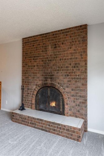 1919 9 Avenue Ne, Medicine Hat, AB - Indoor Photo Showing Living Room With Fireplace