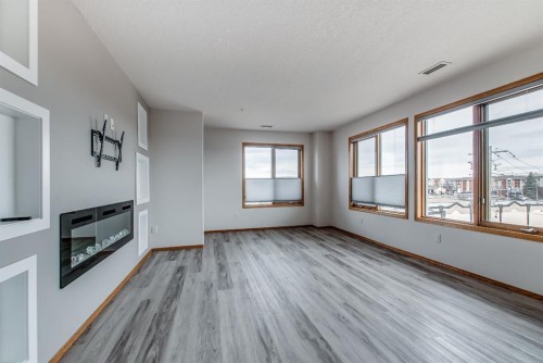 429-1182 Southview Drive Se, Medicine Hat, AB - Indoor Photo Showing Other Room With Fireplace