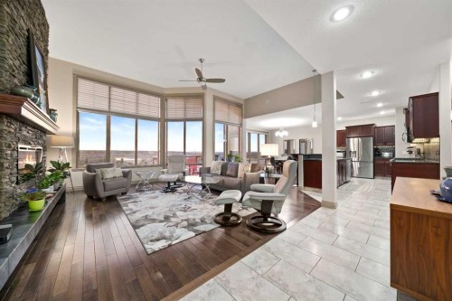 30 Palisades Mews Ne, Medicine Hat, AB - Indoor Photo Showing Living Room With Fireplace