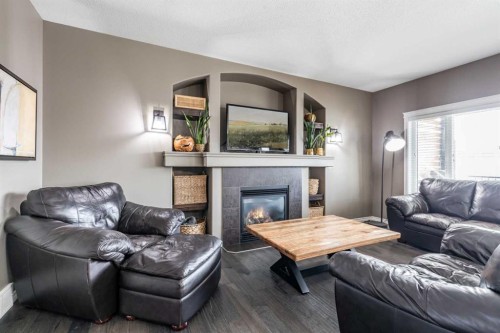 324 Somerside Crescent Se, Medicine Hat, AB - Indoor Photo Showing Living Room With Fireplace