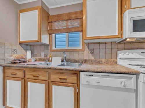 220 Fairchild Street Sw, Medicine Hat, AB - Indoor Photo Showing Kitchen With Double Sink