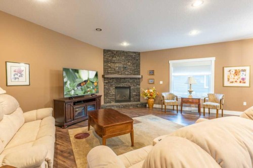 208 Westview Crescent West, Bow Island, AB - Indoor Photo Showing Living Room With Fireplace