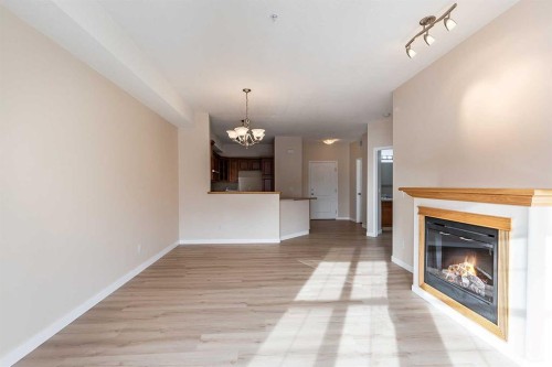 307-29 River Ridge Drive Nw, Medicine Hat, AB - Indoor Photo Showing Living Room With Fireplace