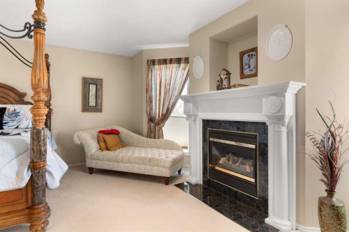 22 Turner Crescent Se, Medicine Hat, AB - Indoor Photo Showing Living Room With Fireplace
