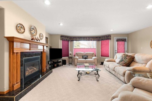 22 Turner Crescent Se, Medicine Hat, AB - Indoor Photo Showing Living Room With Fireplace