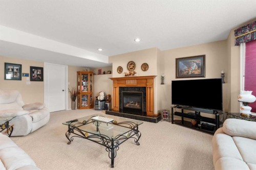 22 Turner Crescent Se, Medicine Hat, AB - Indoor Photo Showing Living Room With Fireplace