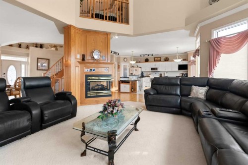22 Turner Crescent Se, Medicine Hat, AB - Indoor Photo Showing Living Room With Fireplace