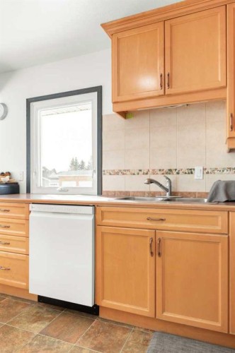 803 2 Avenue West, Foremost, AB - Indoor Photo Showing Kitchen With Double Sink