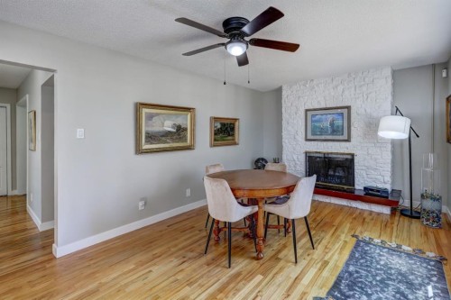 150 9 Street Nw, Drumheller, AB - Indoor Photo Showing Dining Room With Fireplace