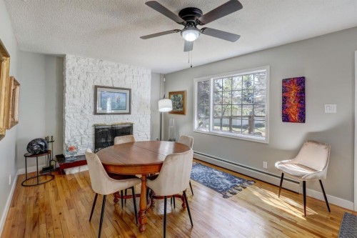 150 9 Street Nw, Drumheller, AB - Indoor Photo Showing Dining Room With Fireplace
