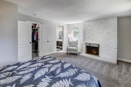 150 9 Street Nw, Drumheller, AB - Indoor Photo Showing Bedroom With Fireplace