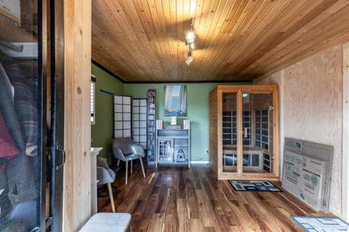425 6 Street, Suffield, AB - Indoor Photo Showing Other Room With Fireplace