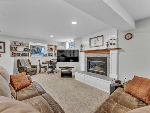 14 Smith Close Se, Medicine Hat, AB - Indoor Photo Showing Living Room With Fireplace