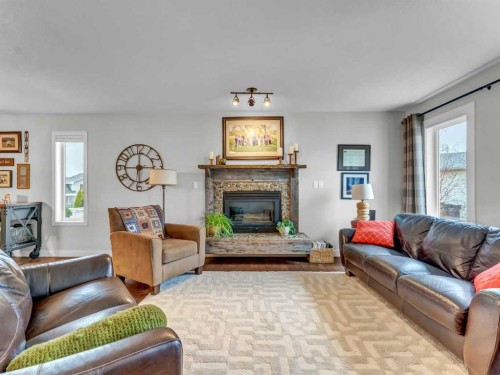 14 Smith Close Se, Medicine Hat, AB - Indoor Photo Showing Living Room With Fireplace