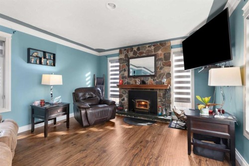 721 4 Avenue, Dunmore, AB - Indoor Photo Showing Living Room With Fireplace