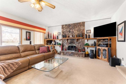 334 5 Street Se, Redcliff, AB - Indoor Photo Showing Living Room With Fireplace