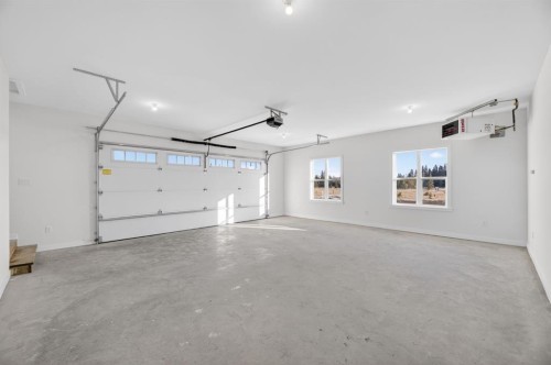 33080 Range Road 61, Rural Mountain View County, AB - Indoor Photo Showing Garage
