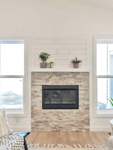 32 Somerside Way Se, Medicine Hat, AB - Indoor Photo Showing Living Room With Fireplace