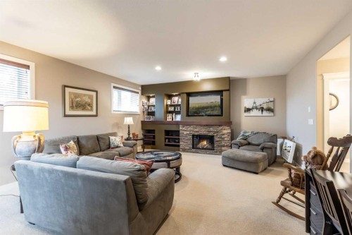 207 Hamptons Way Se, Medicine Hat, AB - Indoor Photo Showing Living Room With Fireplace