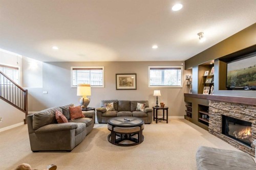 207 Hamptons Way Se, Medicine Hat, AB - Indoor Photo Showing Living Room With Fireplace