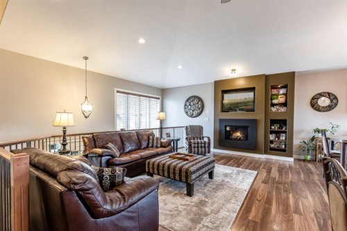 207 Hamptons Way Se, Medicine Hat, AB - Indoor Photo Showing Living Room With Fireplace