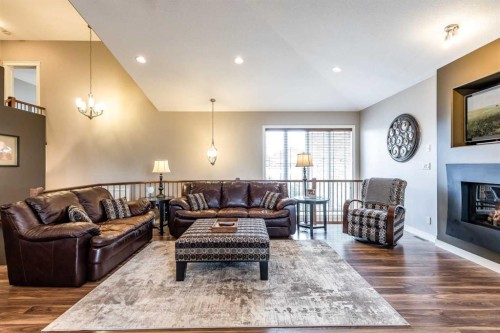 207 Hamptons Way Se, Medicine Hat, AB - Indoor Photo Showing Living Room With Fireplace