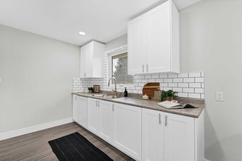 212 11 Street Ne, Medicine Hat, AB - Indoor Photo Showing Kitchen With Double Sink