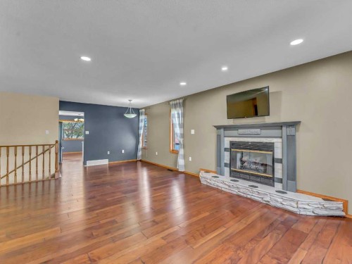 4 Turner Boulevard Se, Medicine Hat, AB - Indoor Photo Showing Living Room With Fireplace