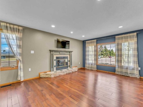 4 Turner Boulevard Se, Medicine Hat, AB - Indoor Photo Showing Living Room With Fireplace