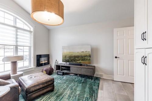 119 Perry Crescent Ne, Medicine Hat, AB - Indoor Photo Showing Other Room With Fireplace