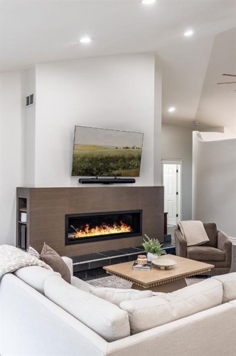 119 Perry Crescent Ne, Medicine Hat, AB - Indoor Photo Showing Living Room With Fireplace