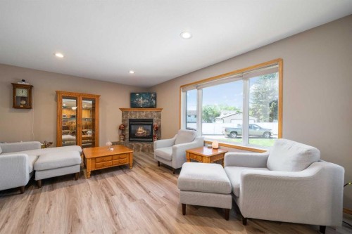 79 Henderson Court Ne, Medicine Hat, AB - Indoor Photo Showing Living Room With Fireplace
