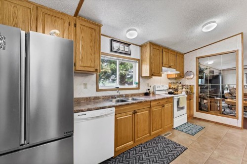 20 Josephine Avenue Sw, Redcliff, AB - Indoor Photo Showing Kitchen With Double Sink