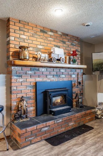 9 Rossmere Avenue Se, Medicine Hat, AB - Indoor Photo Showing Living Room With Fireplace