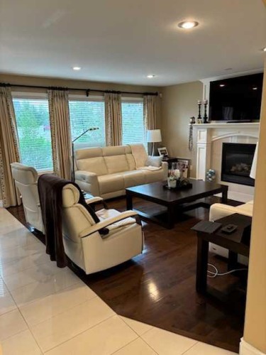 447 Spruce Way Se, Medicine Hat, AB - Indoor Photo Showing Living Room With Fireplace