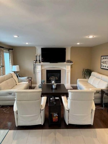 447 Spruce Way Se, Medicine Hat, AB - Indoor Photo Showing Other Room With Fireplace