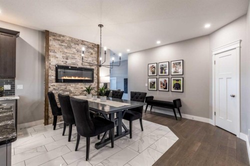 936 Maskell Place Se, Redcliff, AB - Indoor Photo Showing Dining Room With Fireplace