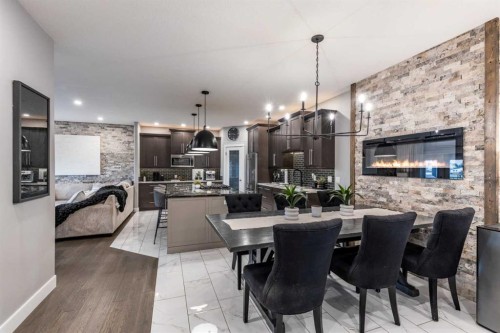 936 Maskell Place Se, Redcliff, AB - Indoor Photo Showing Dining Room With Fireplace